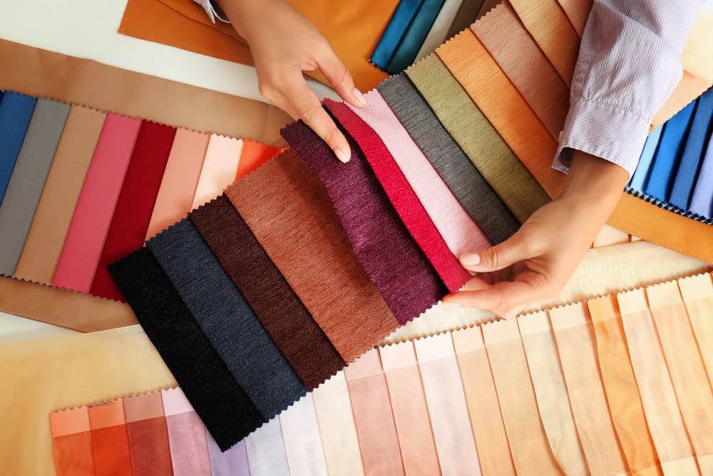 Table comparing cotton, polyester, CVC, TC, and other fabrics used in t-shirt manufacturing.